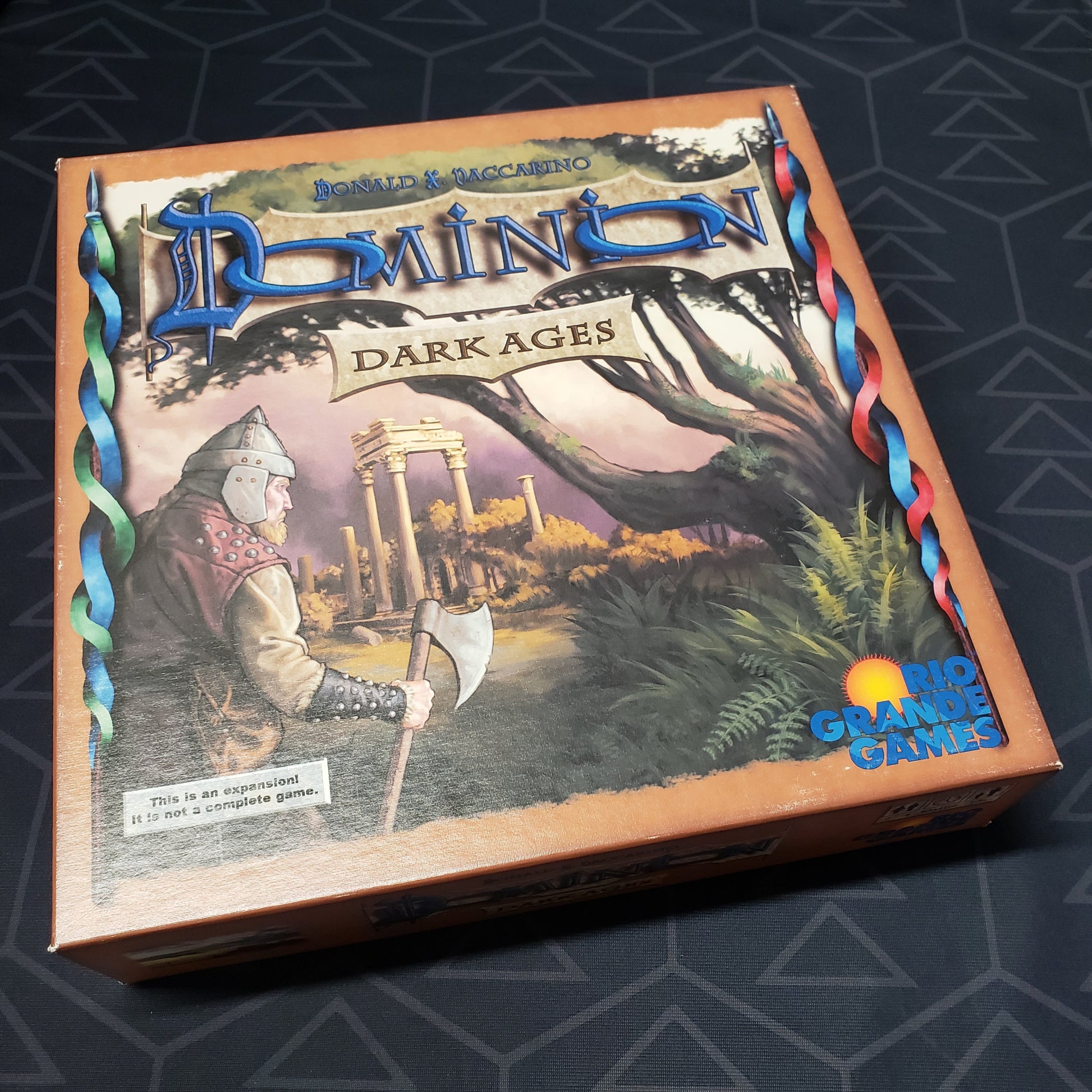 Image shows the front cover of the box for the Dominion: Dark Ages card game expansion