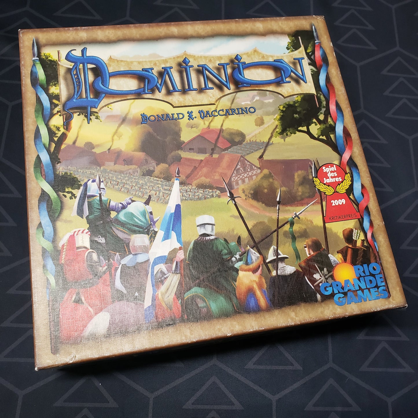 Image shows the front cover of the box for the Dominion (First Edition) card game
