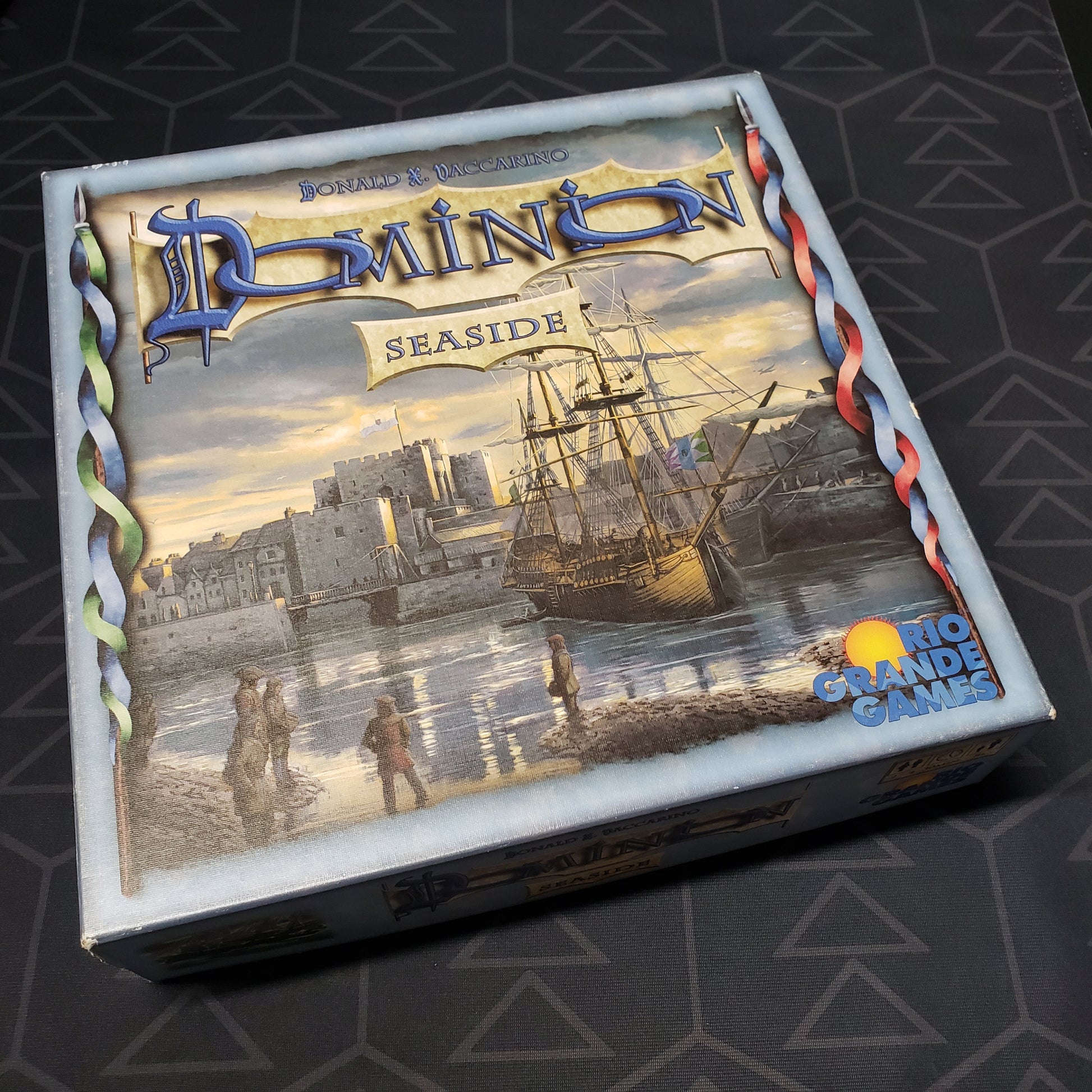 Image shows the front cover of the box for the Dominion: Seaside card game