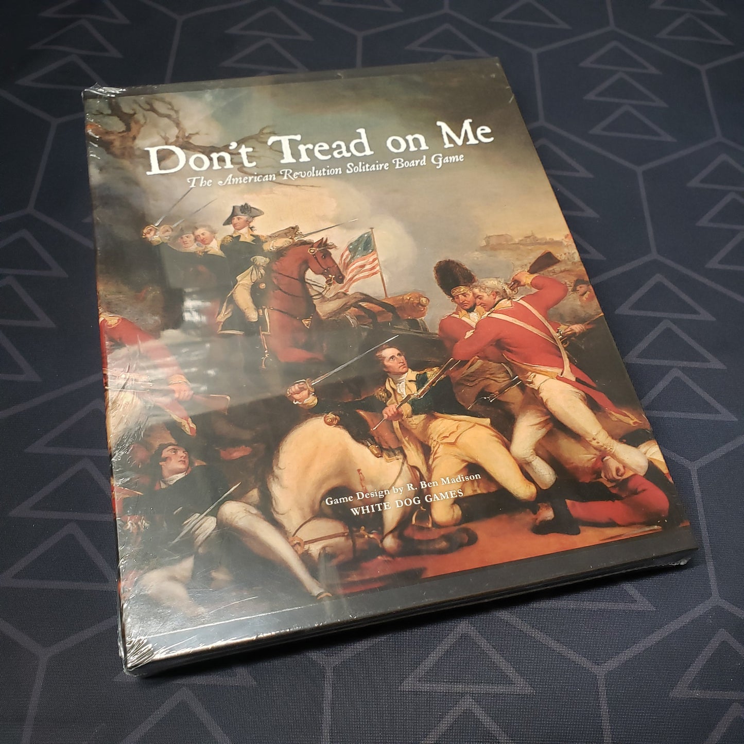 Image shows the front cover of the box for the Don't Tread on Me solo board game