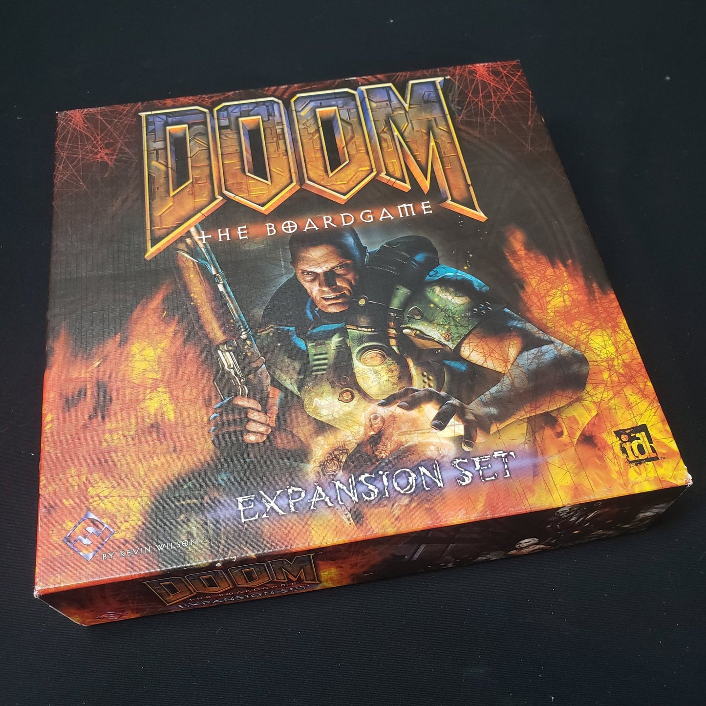 Image shows the front cover of the box of the Expansion Set for Doom: The Board Game