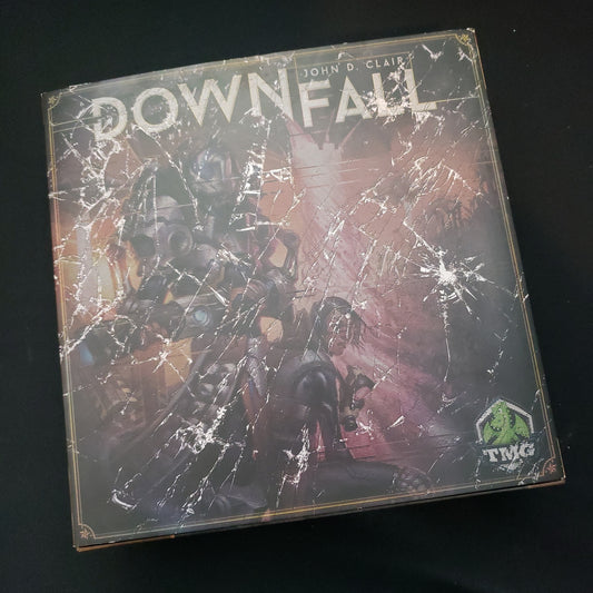 Image shows the front cover of the box of the Downfall board game