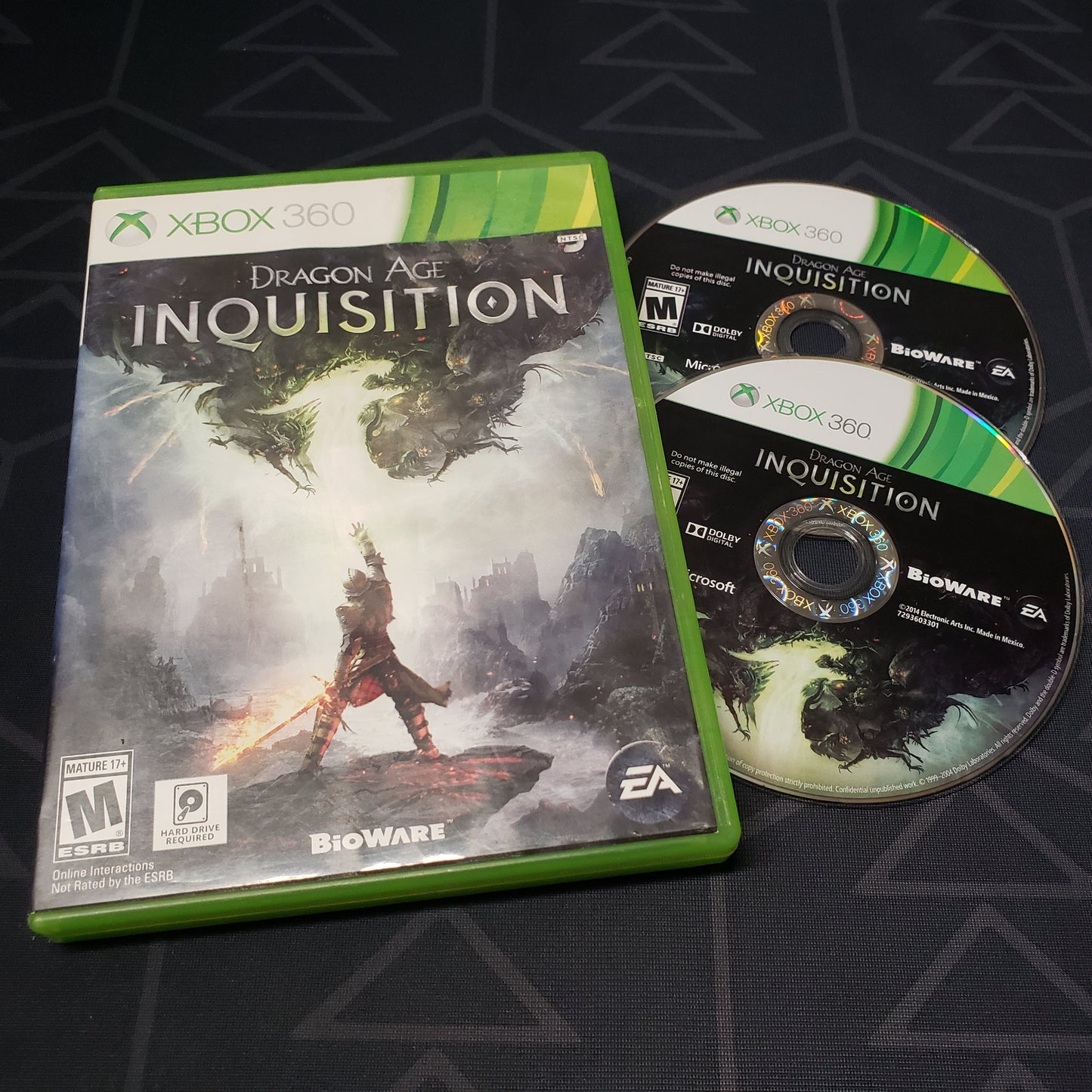 Image shows the case and two discs for the video game Dragon Age: Inquisition for Xbox 360