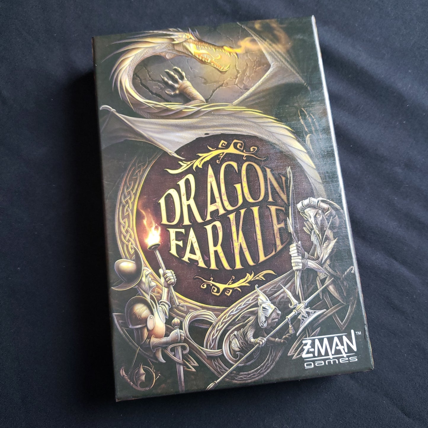 Image shows the front cover of the box of the Dragon Farkle dice game