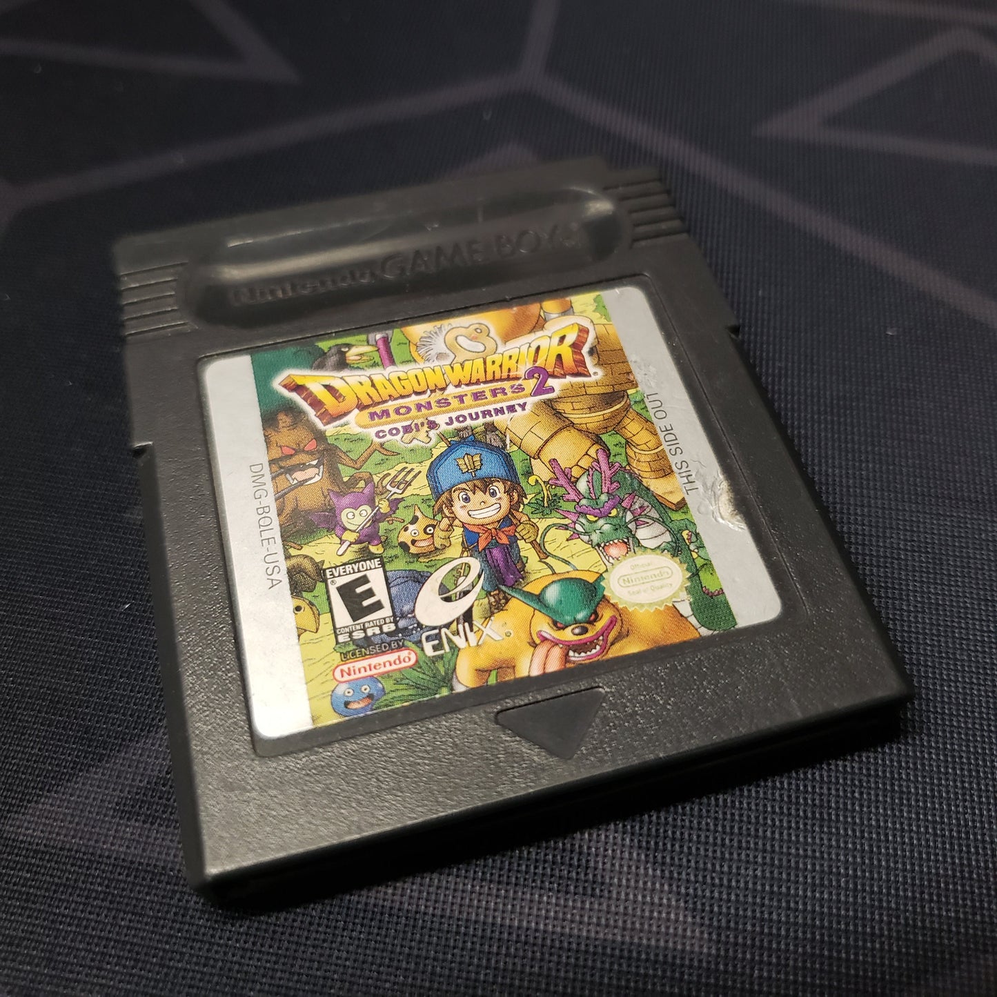 Image shows the front of the cartridge for the video game Dragon Warrior Monsters 2: Cobi's Journey for Nintendo Game Boy Color