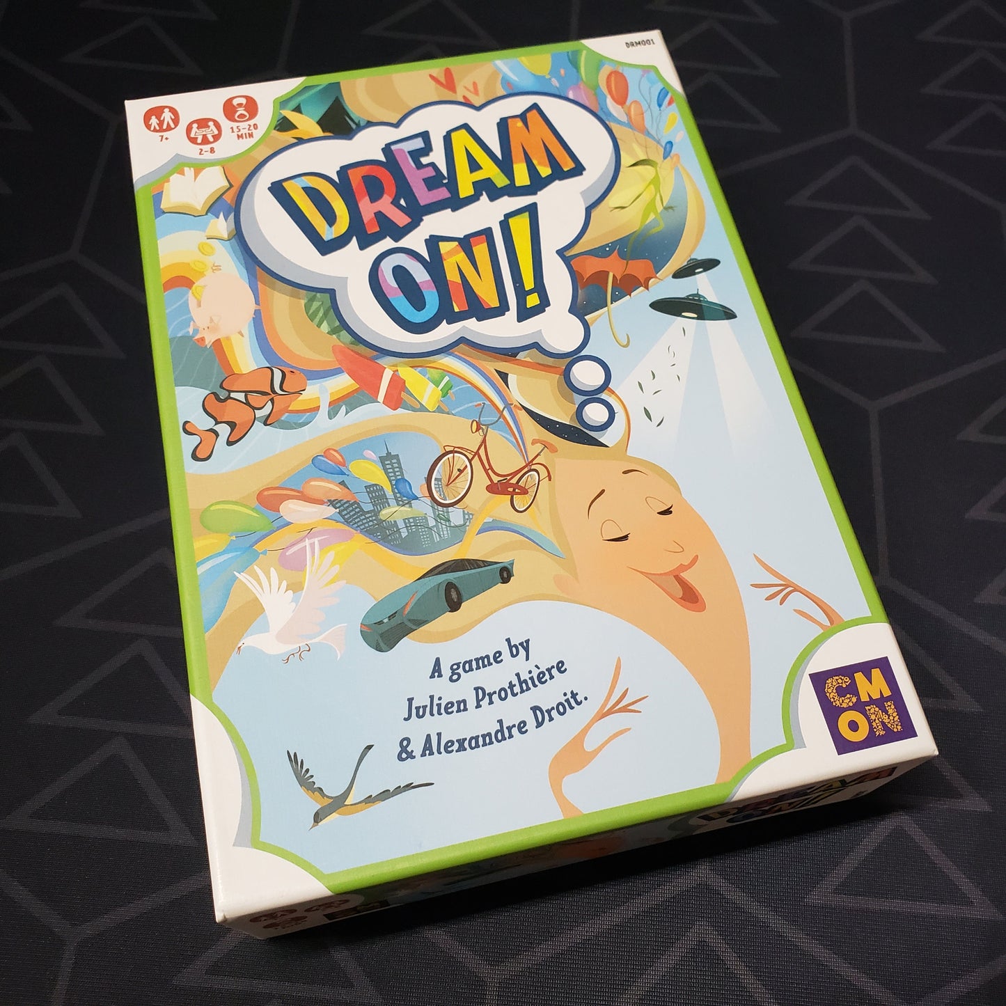 Image shows the front cover of the box of the Dream On! card game