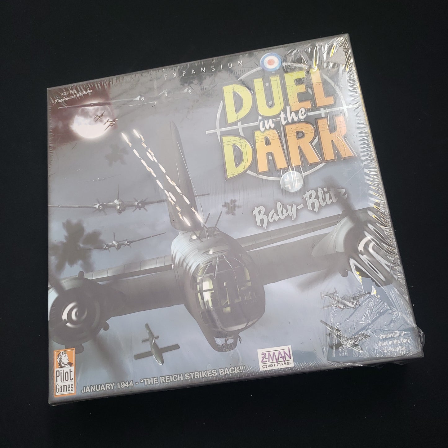 Image shows the front cover of the box of the Baby Blitz expansion for the board game Duel In The Dark