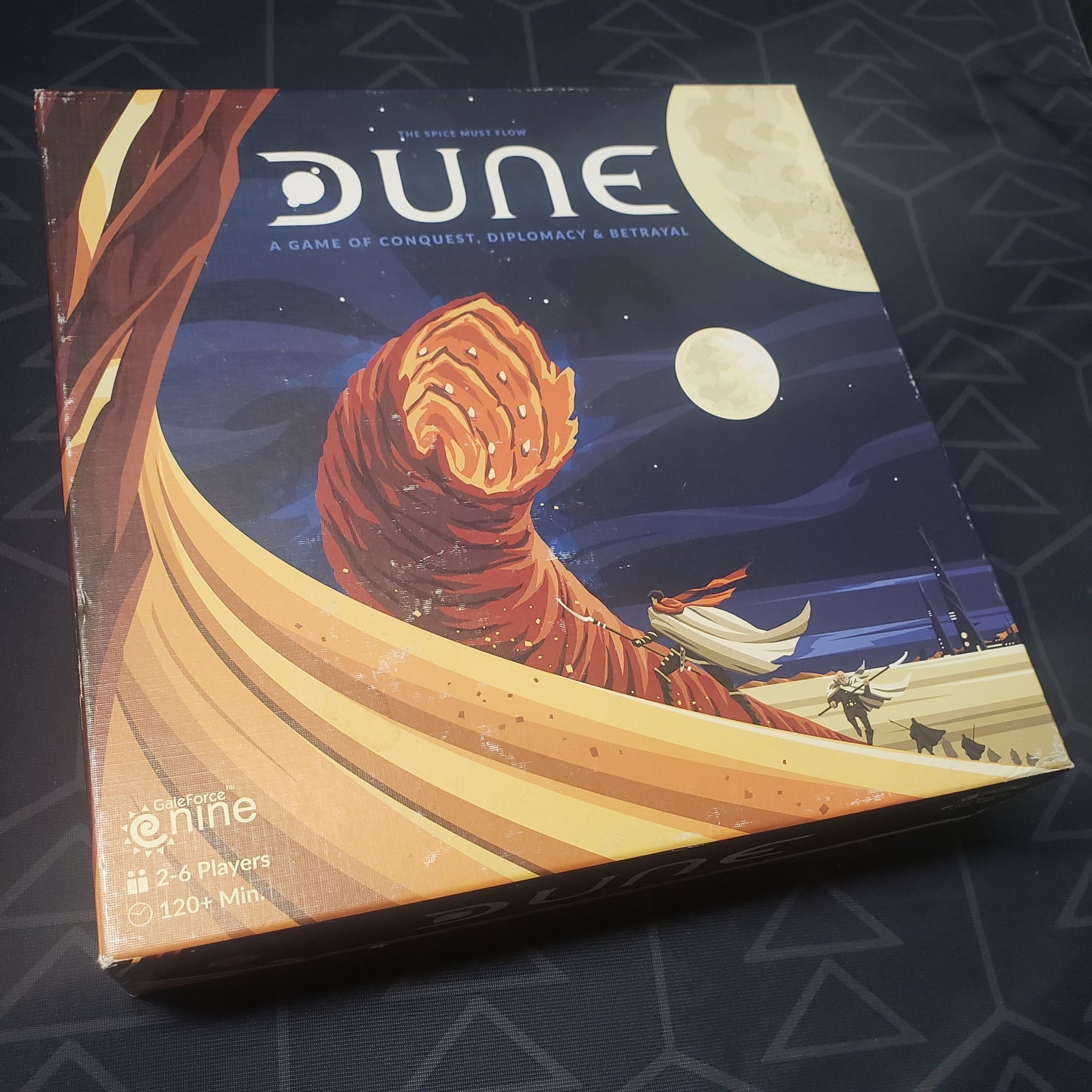 Image shows the front cover of the box for the Dune board game