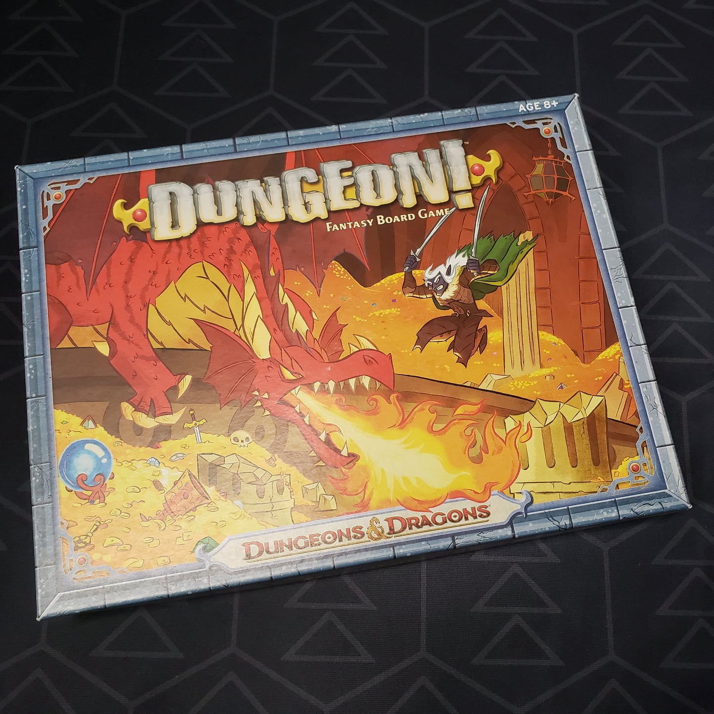 Image shows the front cover of the box of the 2014 printing of the board game Dungeon!