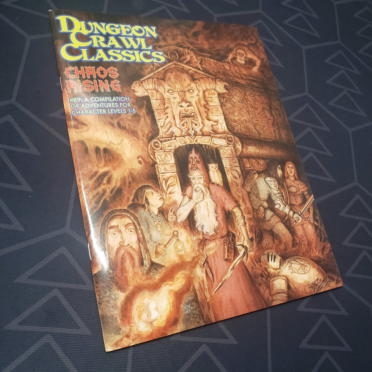 Image shows the front cover of the Chaos Rising book for the roleplaying game Dungeon Crawl Classics