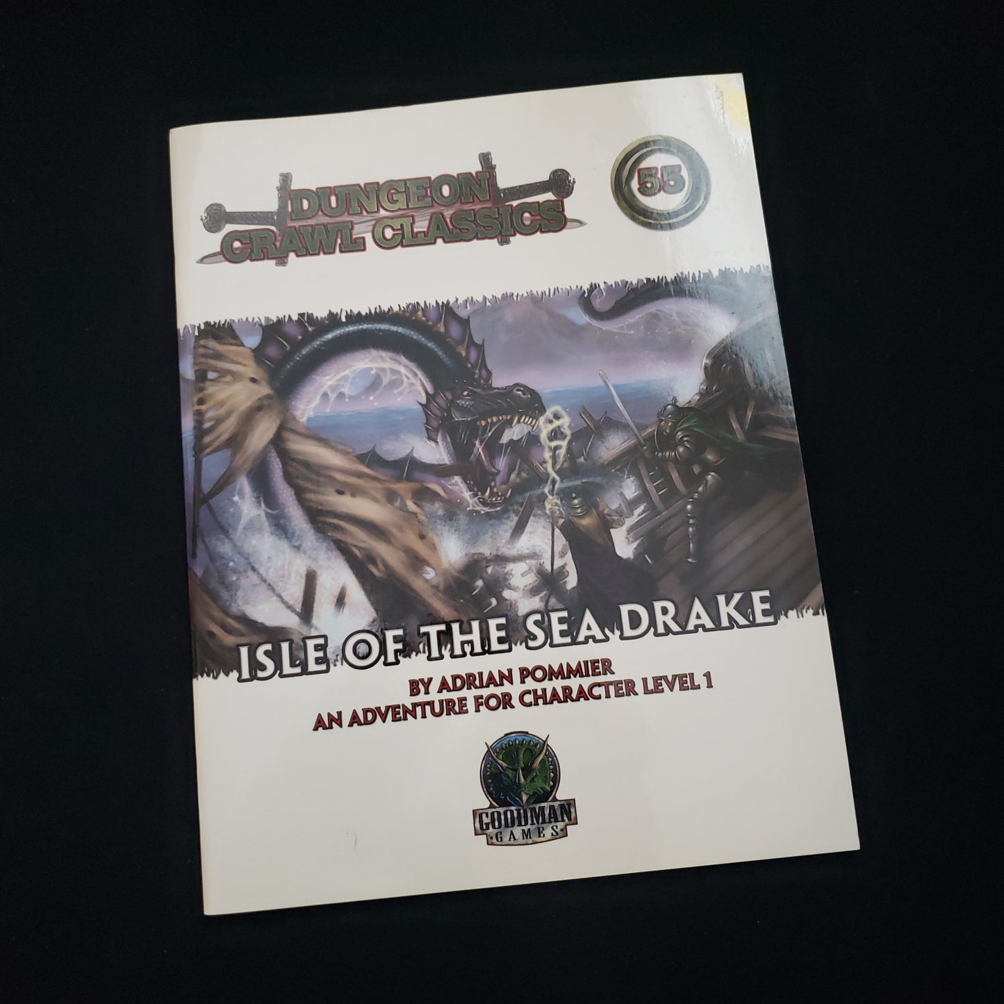 Image shows the front cover of the DCC: Isle of the Sea Drake roleplaying game book
