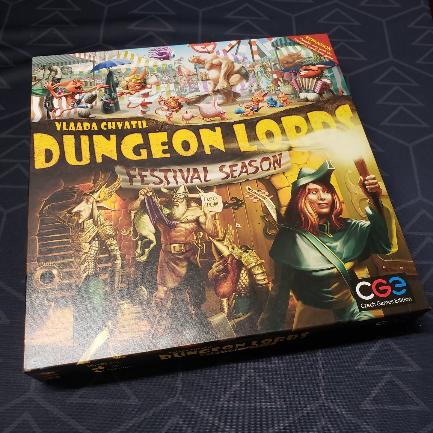 Image shows the front of the box for the Festival Season expansion for the board game Dungeon Lords