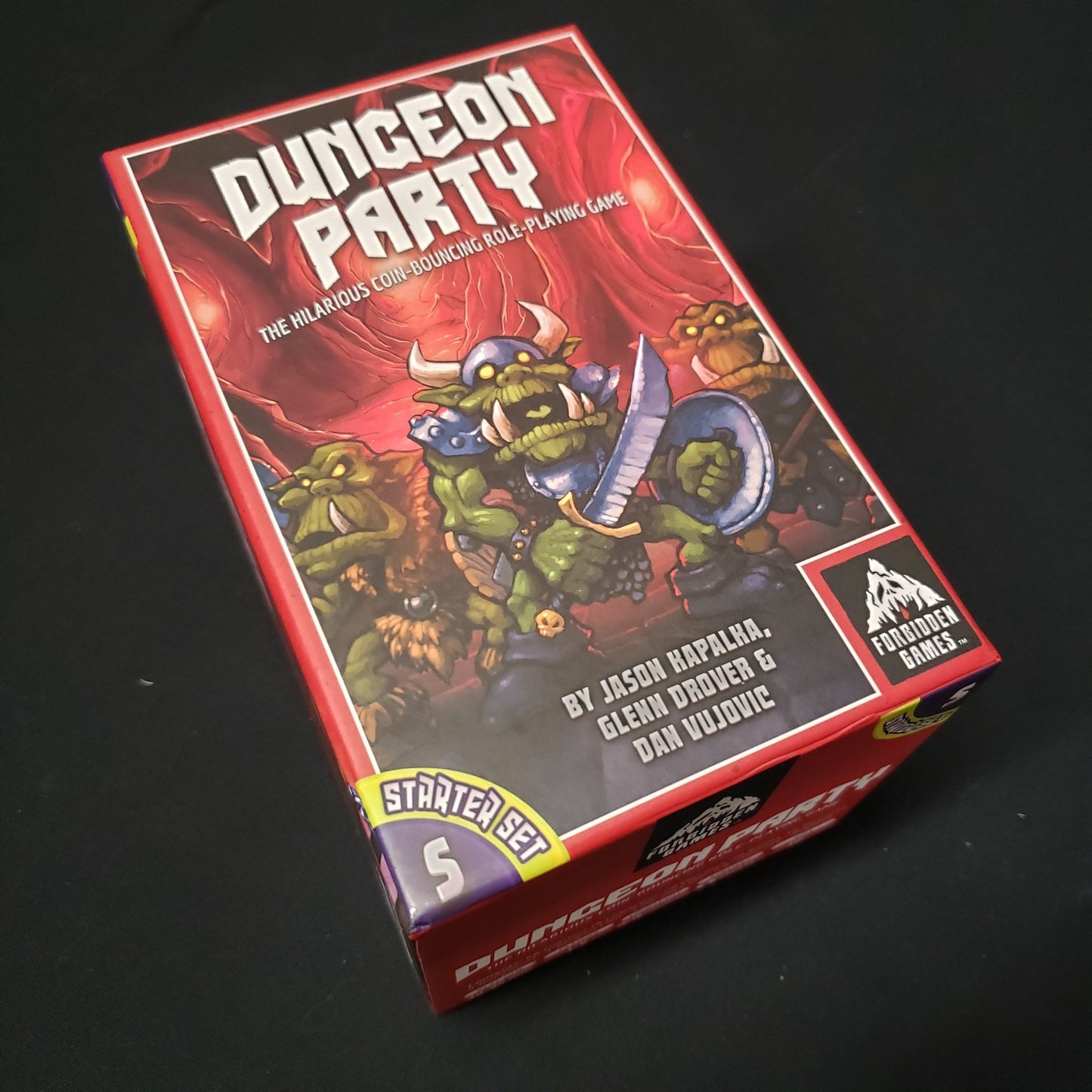 Image shows the front cover of the box of the Starter set for the board game Dungeon Party