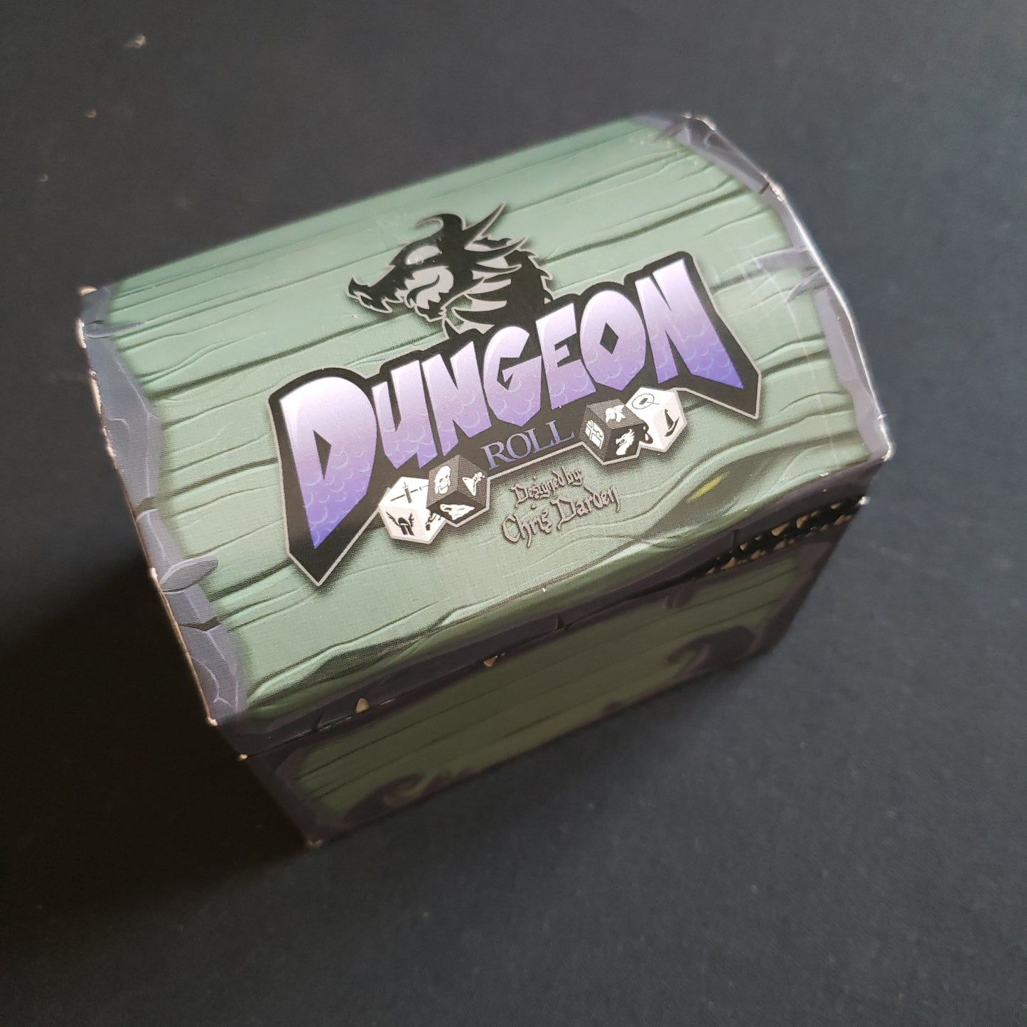 Image shows the top of the Kickstarter Variant box for the Dungeon Roll board game