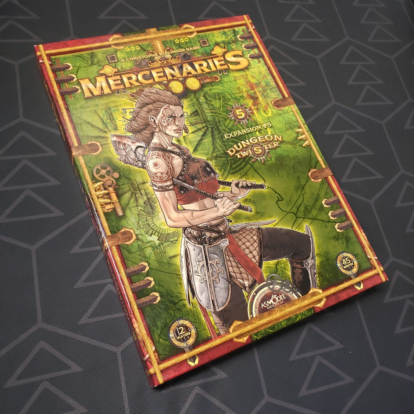 Image shows the front cover of the box of the Mercenaries expansion for the board game Dungeon Twister
