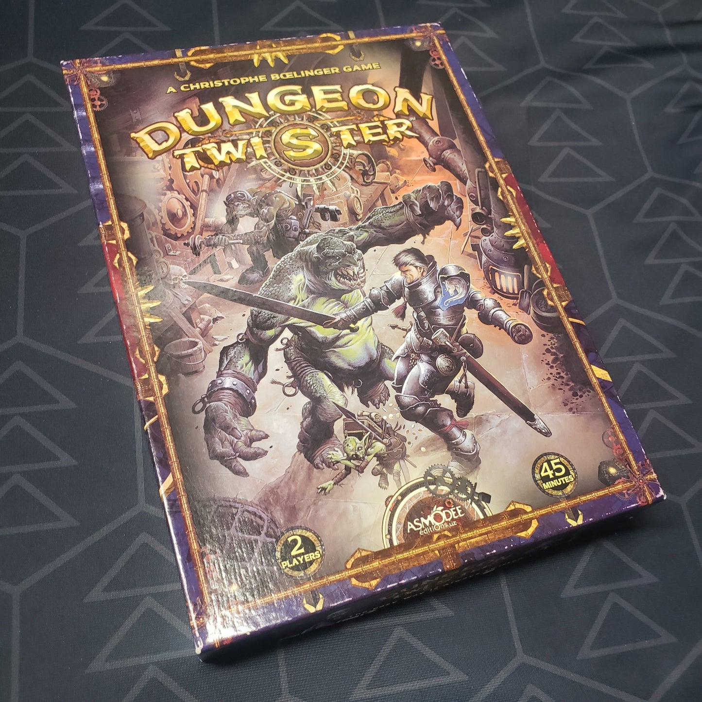 Image shows the front cover of the box of the Dungeon Twister board game