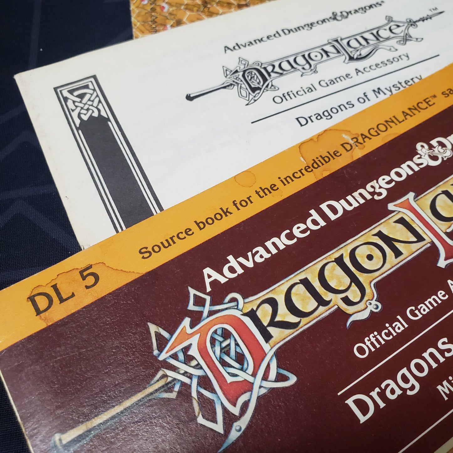 Image show a close up of some light staining on an RPG module book