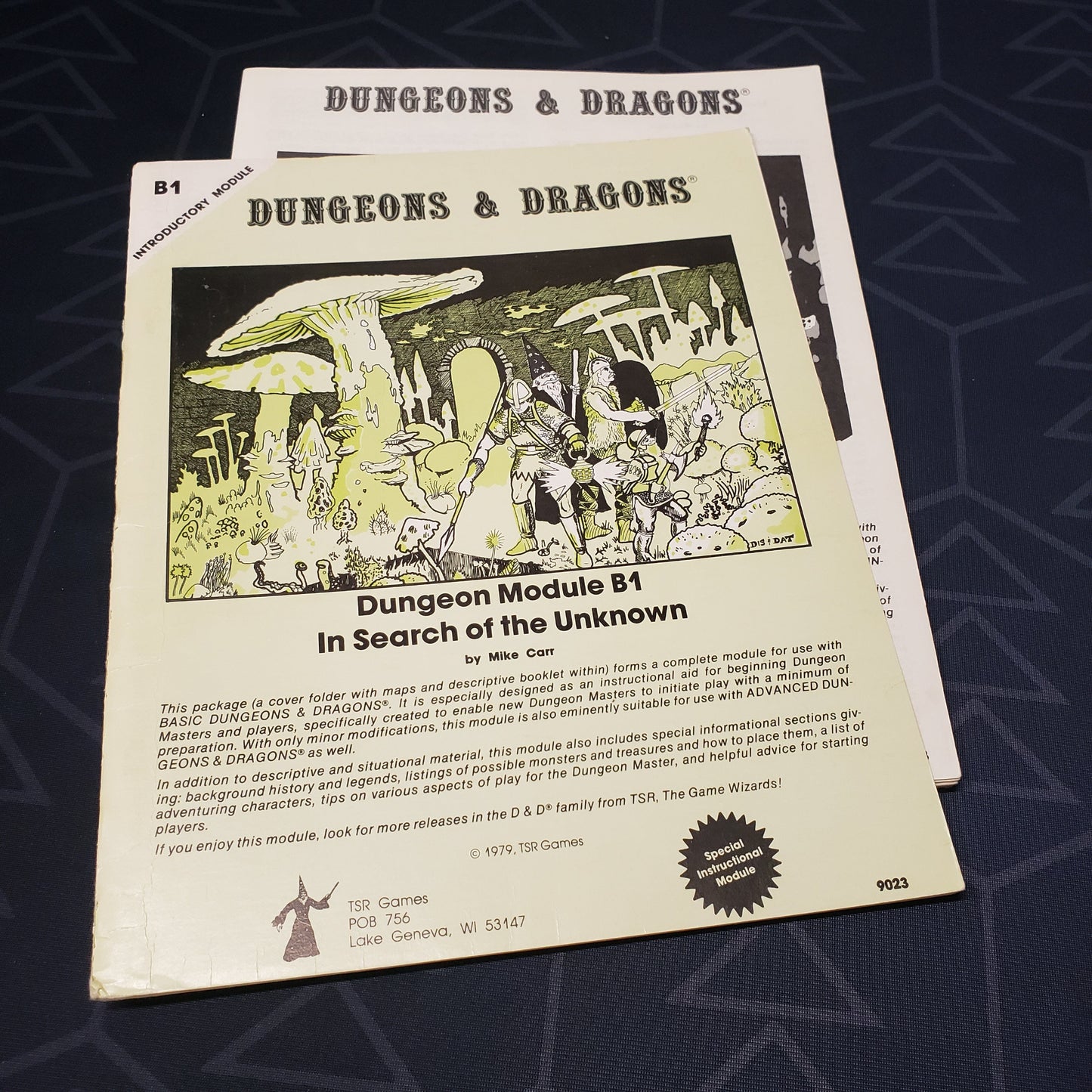 Image shows the front cover of the folio for the In Search of the Unknown adventure module for the roleplaying game Dungeons & Dragons: First Edition, with the booklet fanned out