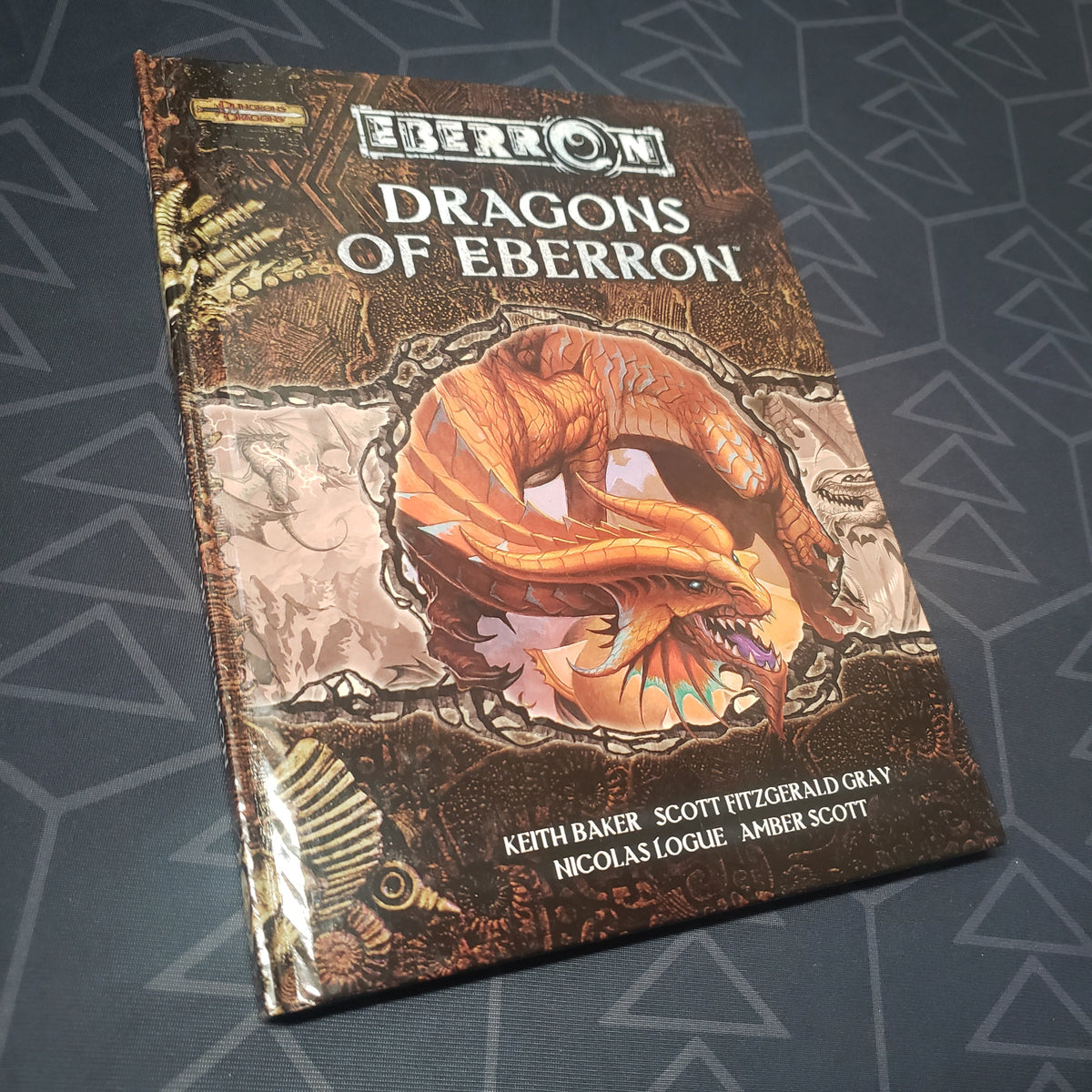 Image shows the front cover of the Dragons of Eberron book for the roleplaying game Dungeons & Dragons 3.5E