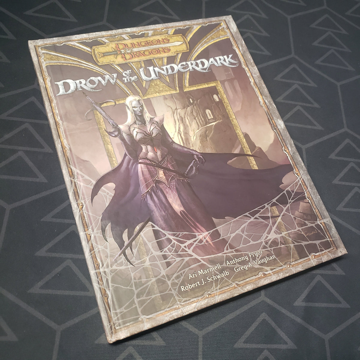 Image shows the front cover of the Drow of the Underdark book for the roleplaying game Dungeons & Dragons 3.5E