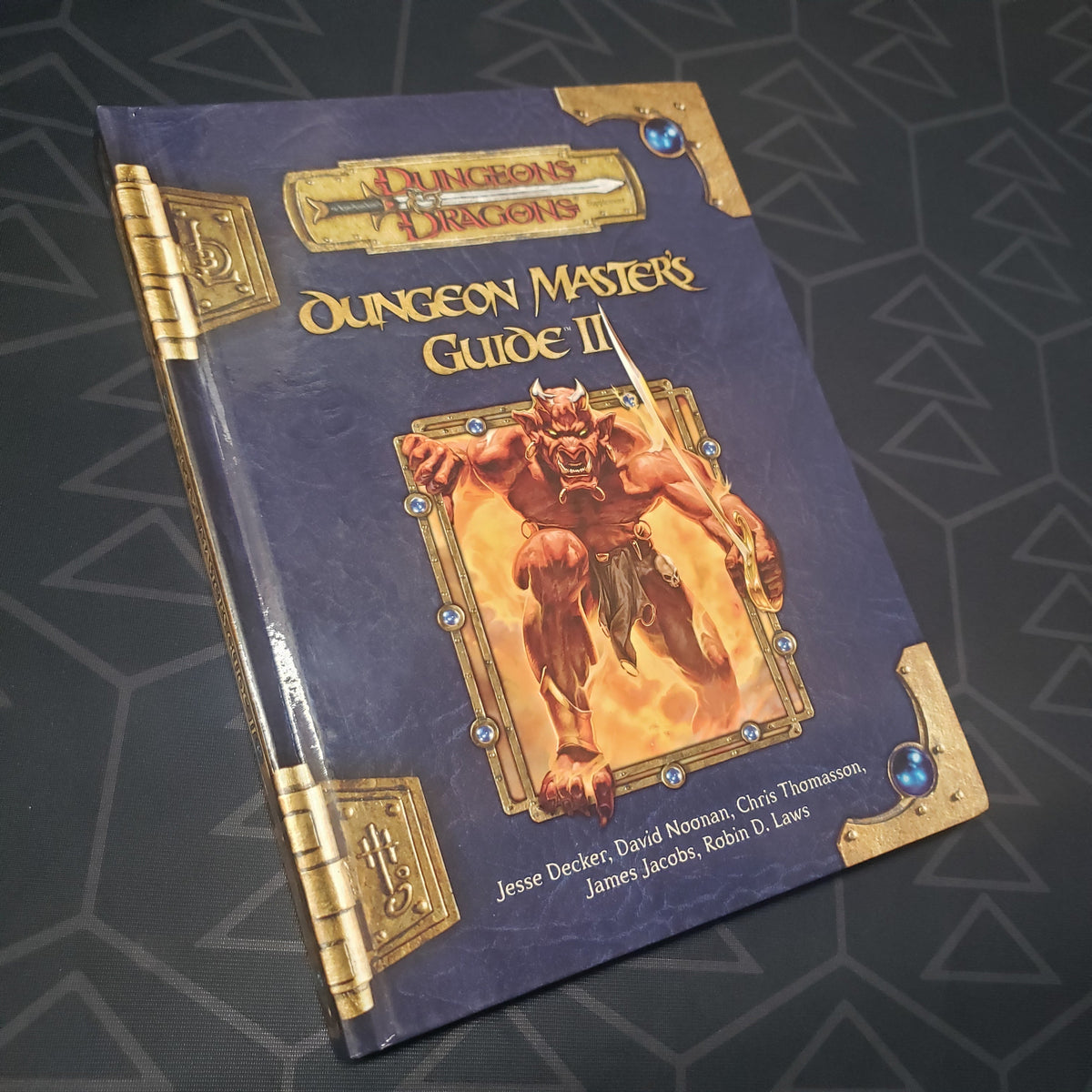 Image shows the front cover of the Dungeon Master's Guide II book for the roleplaying game Dungeons & Dragons 3.5E