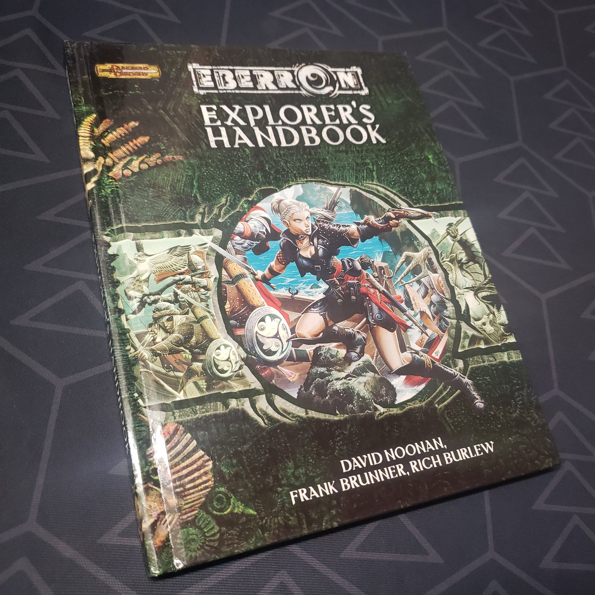 Image shows the front cover of the Eberron: Explorer's Handbook book for the roleplaying game Dungeons & Dragons 3.5E