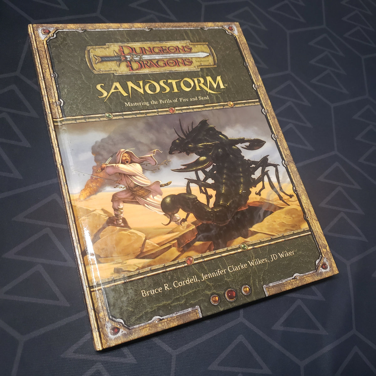 Image shows the front cover of the Sandstorm book for the roleplaying game Dungeons & Dragons 3.5E