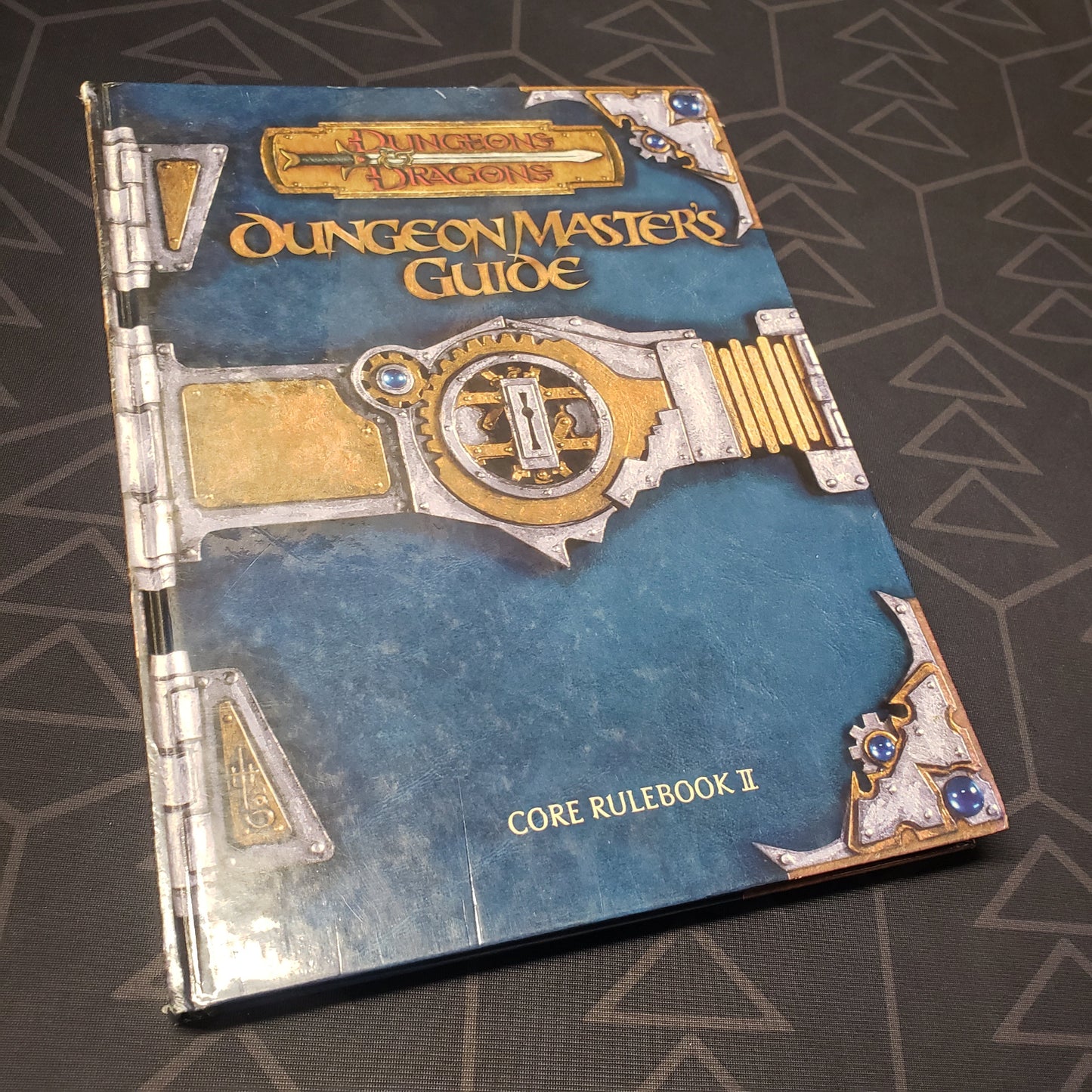 Image shows the front cover of the Dungeon Master's Guide book for the roleplaying game Dungeons & Dragons: Third Edition