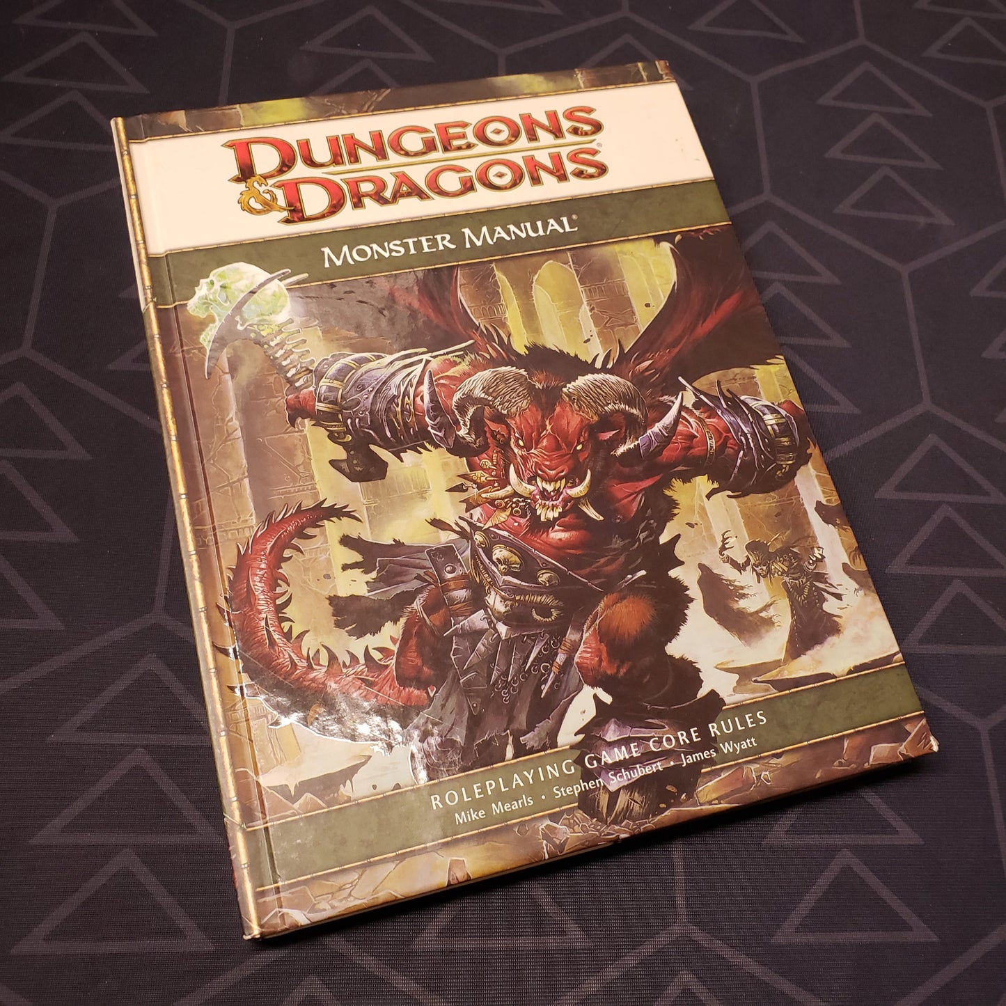 Image shows the front cover of the Monster Manual book for the roleplaying game Dungeons & Dragons: Fourth Edition