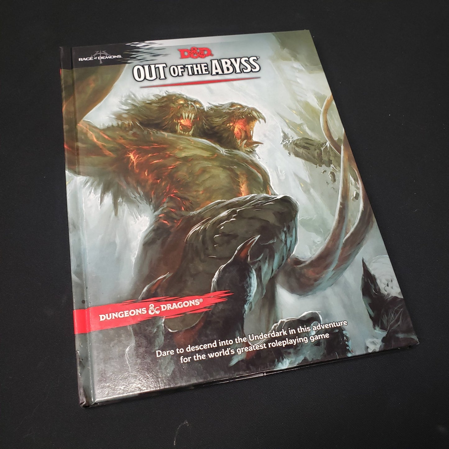 Image shows the front cover of the Out of the Abyss book for the roleplaying game Dungeons & Dragons: Fifth Edition