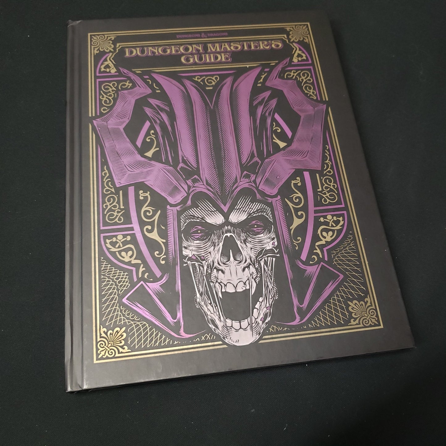 Image shows the front alternate art cover of the Dungeon Master's Guide book for the roleplaying game Dungeons & Dragons: Fifth Edition