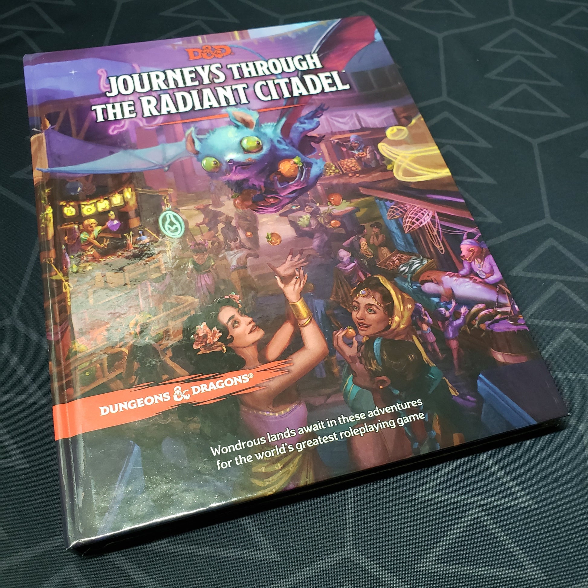 Image shows the front cover of the Journeys Through The Radiant Citadel book for the roleplaying game Dungeons & Dragons 5E