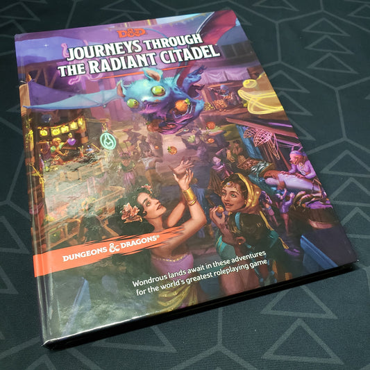 Image shows the front cover of the Journeys Through The Radiant Citadel book for the roleplaying game Dungeons & Dragons 5E