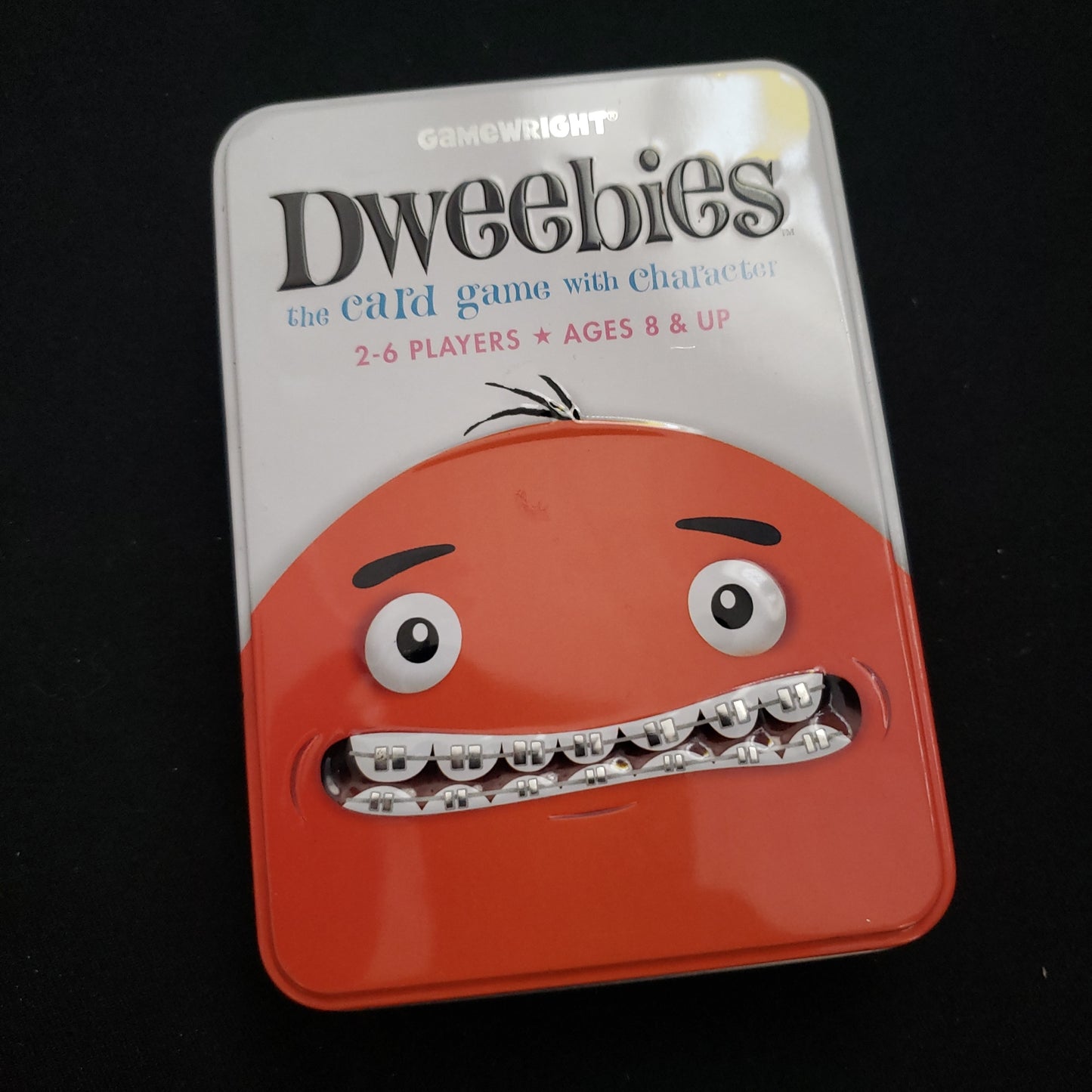 Image shows the front cover of the box of the Dweebies card game