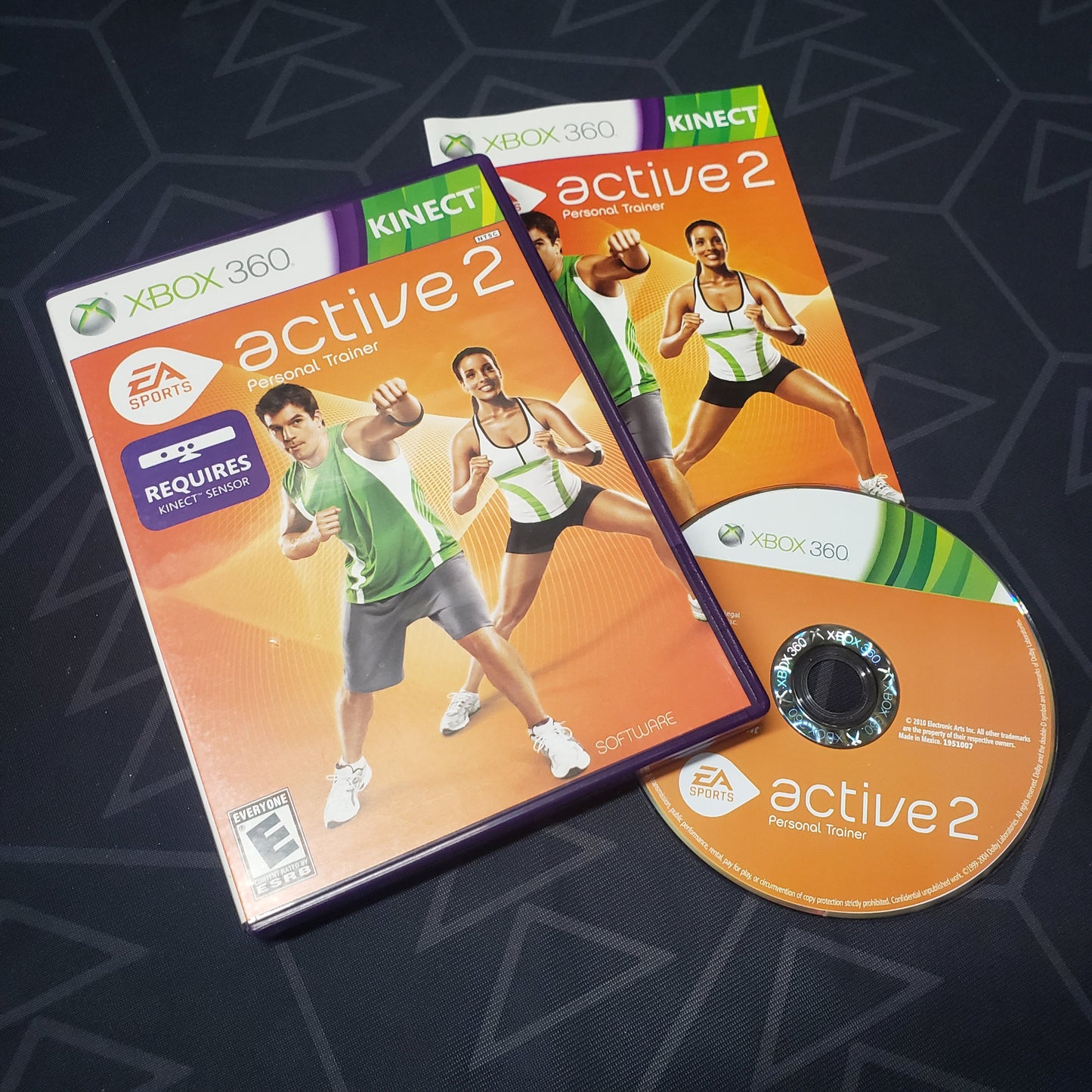 Image shows the case, manual and disc for the video game EA Sports Active 2 for Xbox 360