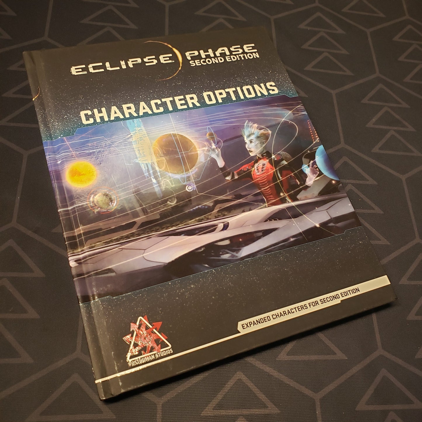 Image shows the front cover of the Character Options book for the roleplaying game Eclipse Phase 2E