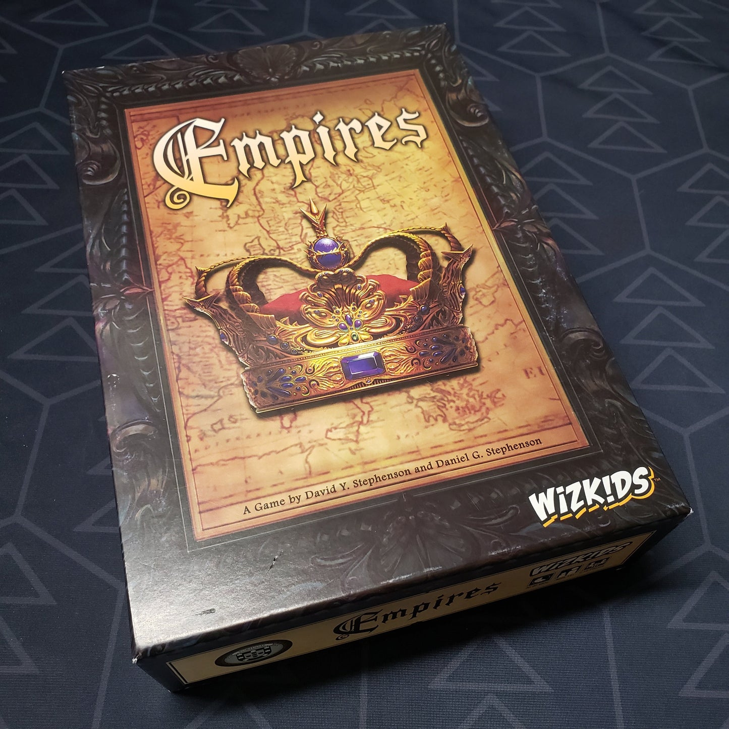 Image shows the front cover of the box of the Empires board game