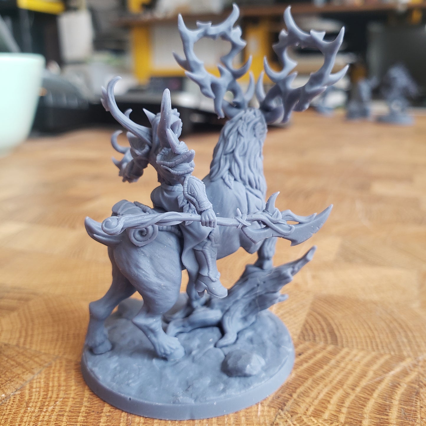 Image is a photo of a 3D printed gaming miniature printed in-house at All Systems Go depicting an elf ranger riding a stag