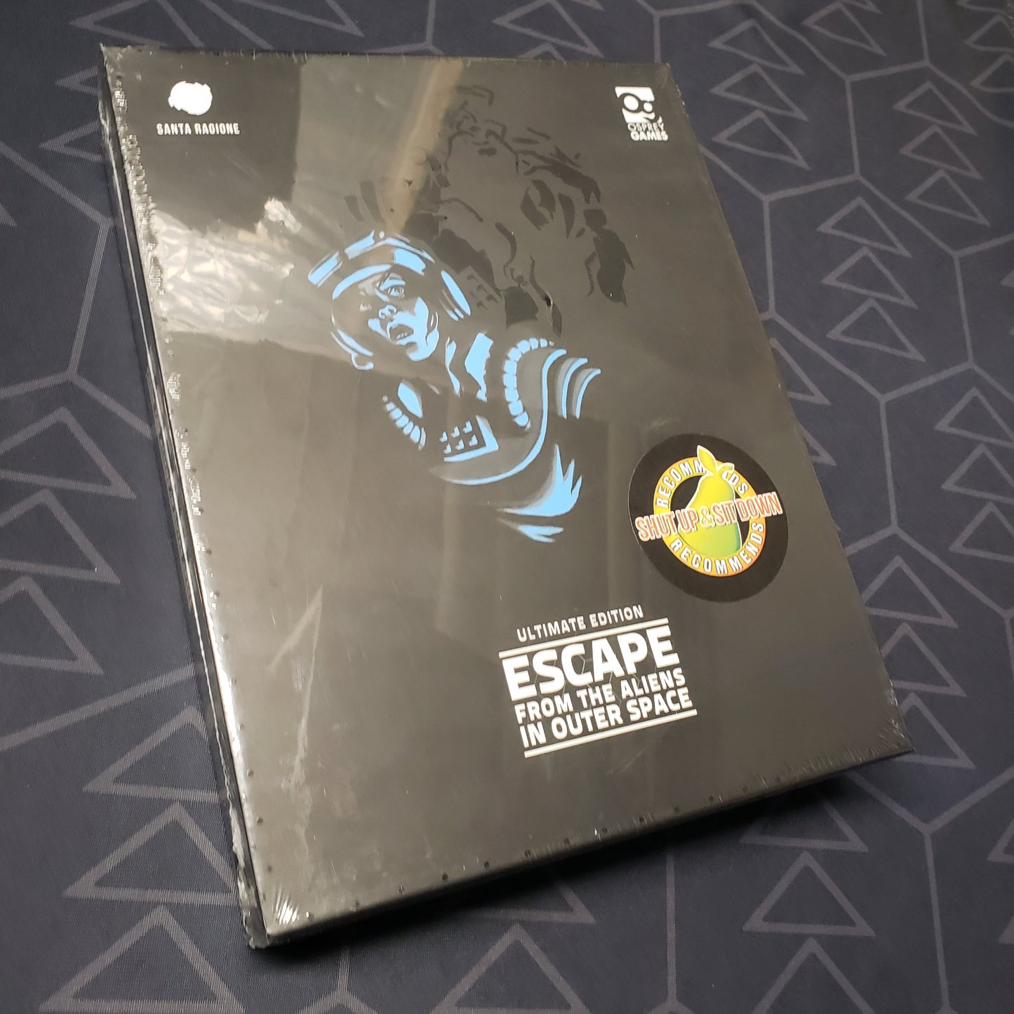 Image shows the front cover of the box of the board game Escape from the Aliens in Outer Space