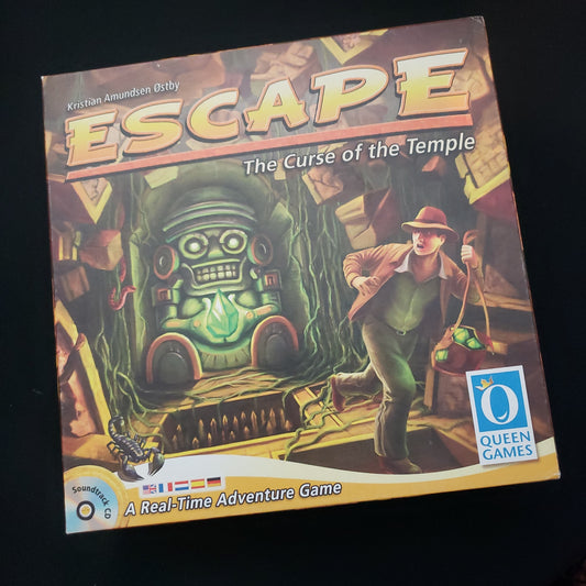 Image shows the front cover of the box of the board game escape: The Curse of the Temple