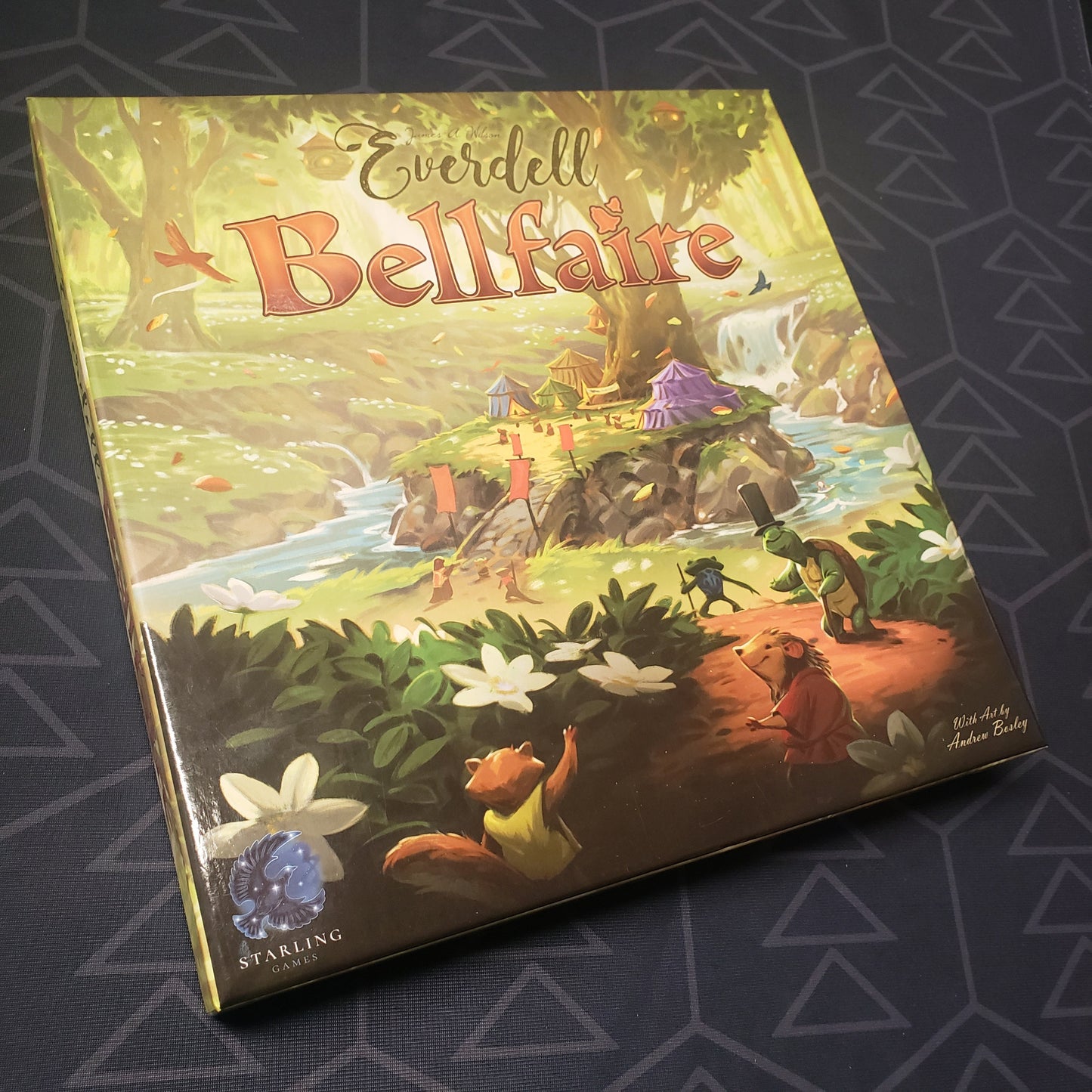 Image shows the front cover of the box of the Bellfaire expansion for the board game Everdell