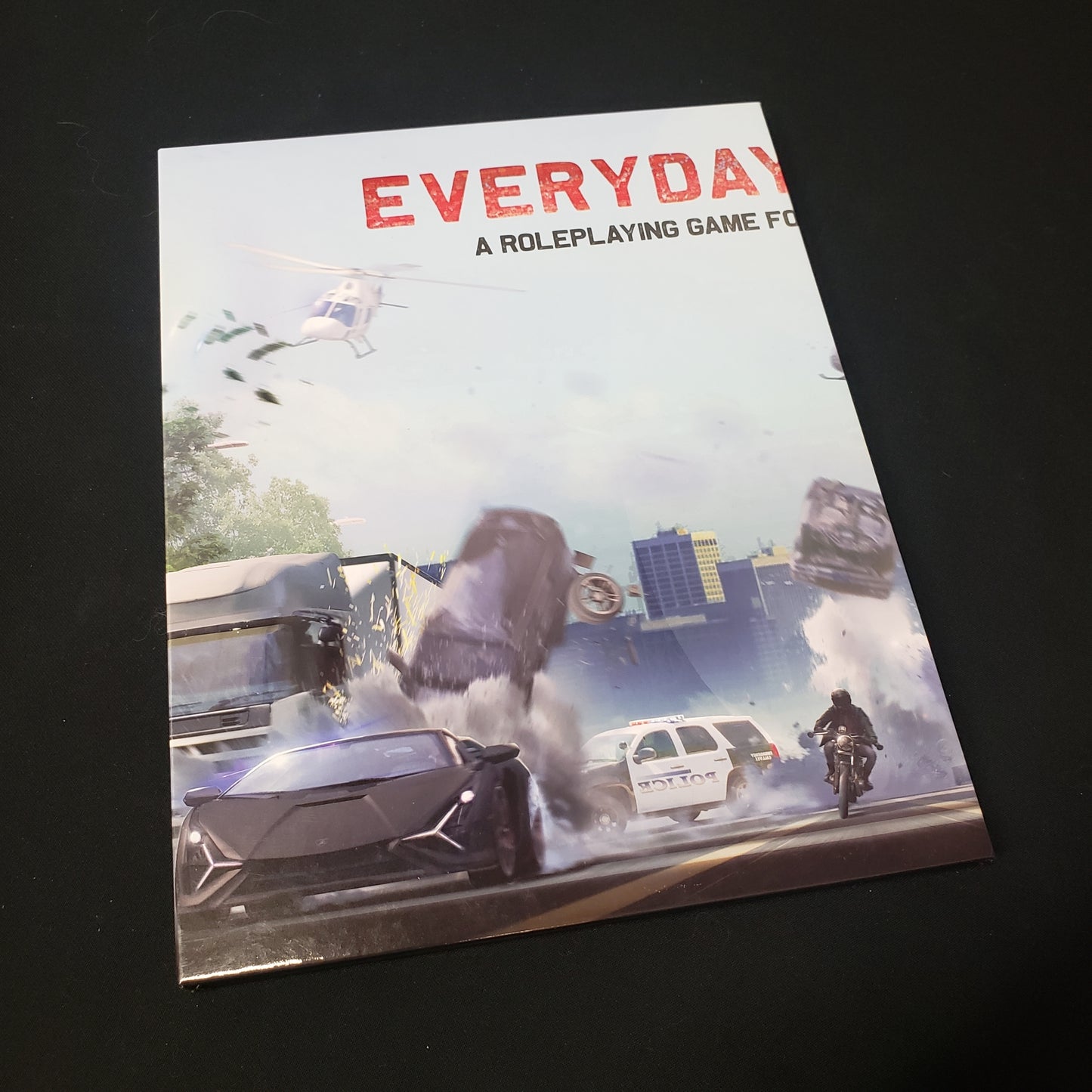 Image shows one panel of the GM Screen for the Everyday Heroes roleplaying game book