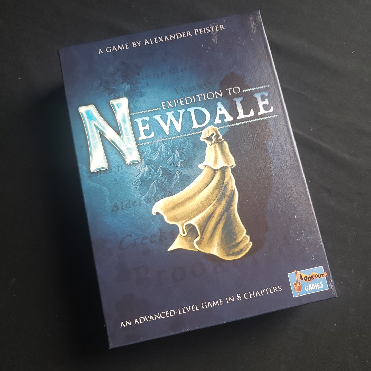 Image shows the front cover of the box of the Expedition to Newdale board game