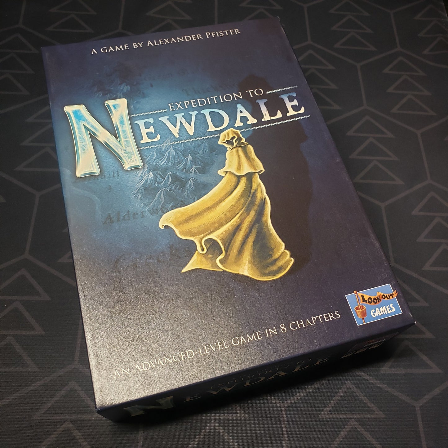 Image shows the front cover of the box of the Expedition to Newdale board game