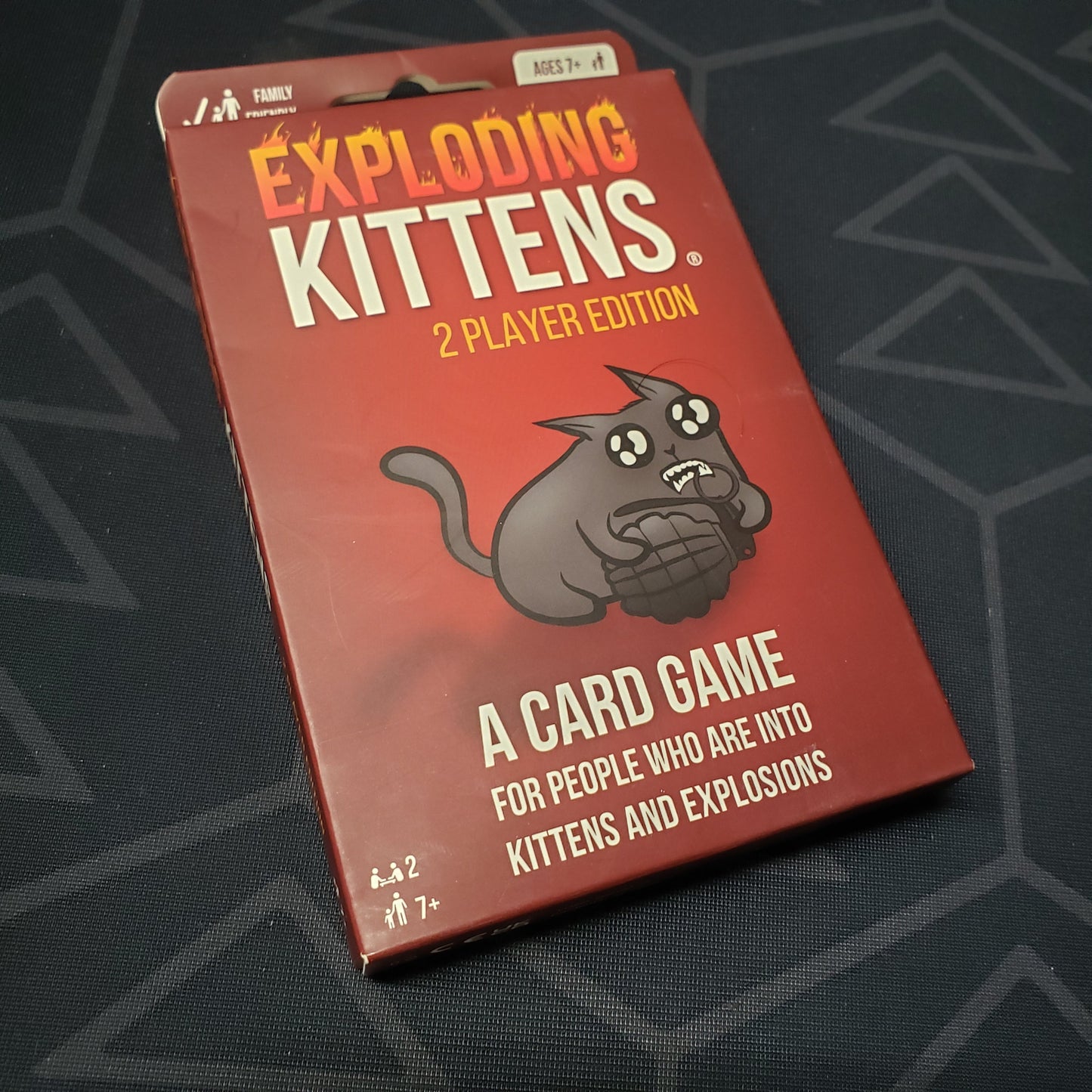 Image shows the front cover of the box for the Exploding Kittens: 2-Player Edition card game