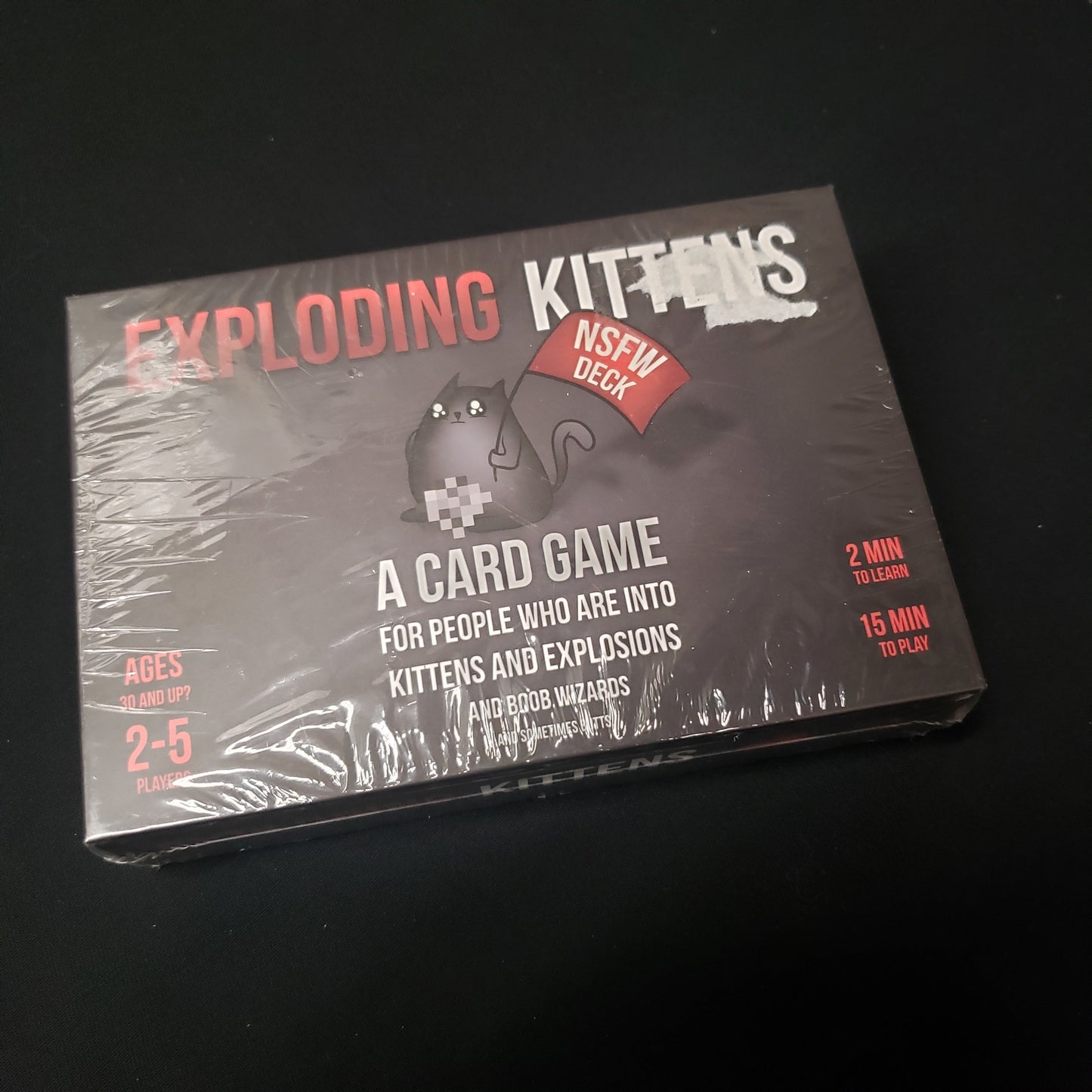 Image shows the front cover of the box of the NSFW Deck for the card game Exploding Kittens