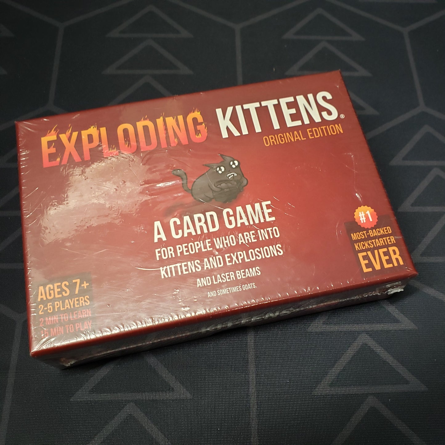 Image shows the front cover of the box for the Exploding Kittens card game