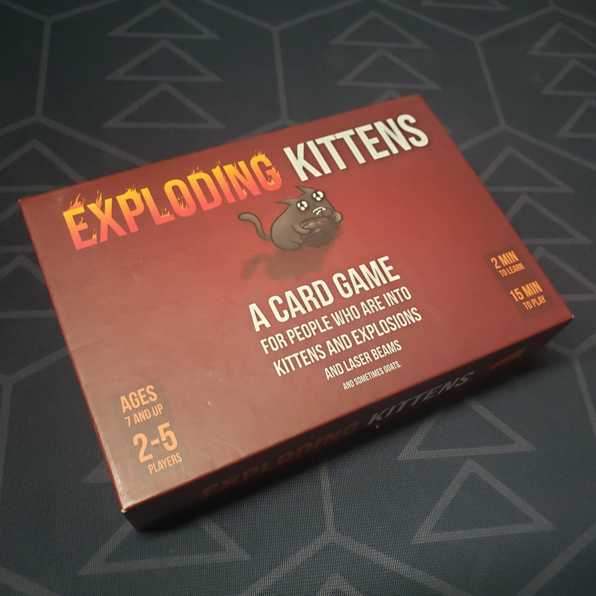 Image shows the front cover of the box for the Exploding Kittens card game