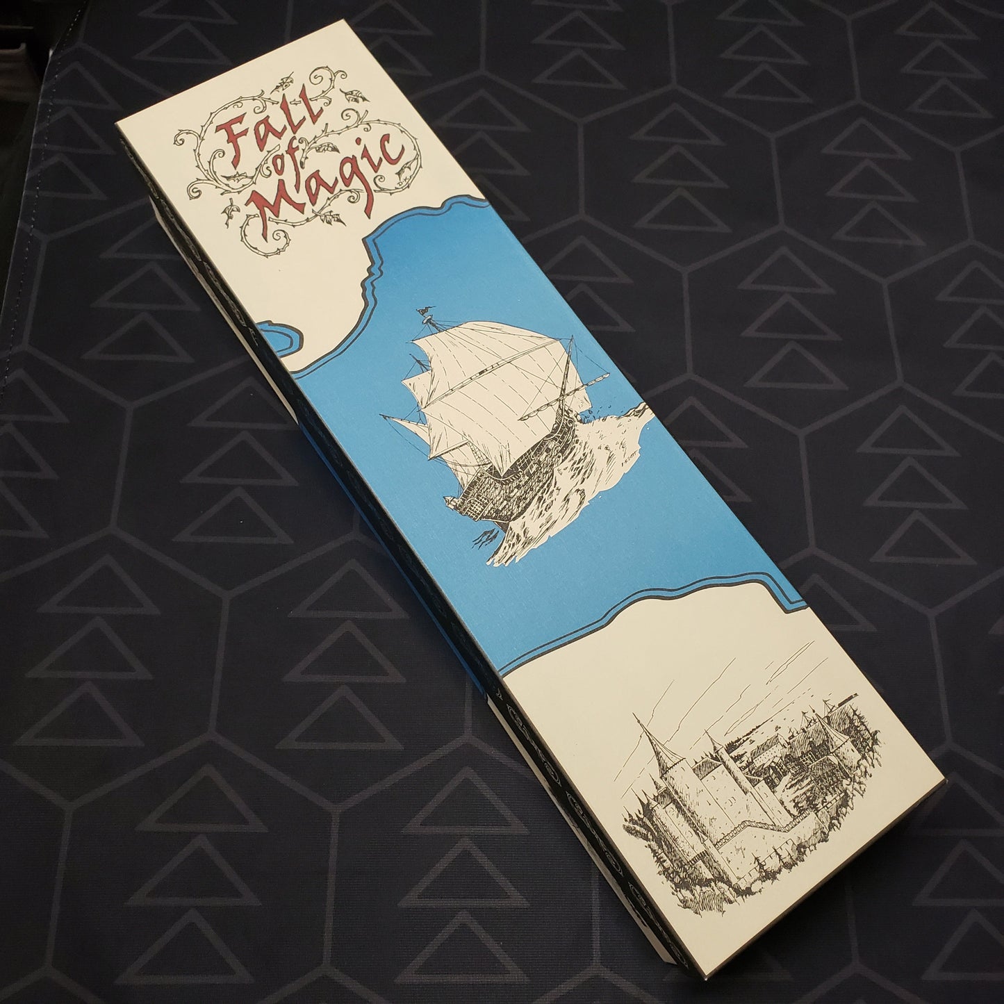 Image shows the front cover of the box set for the roleplaying game Fall of Magic