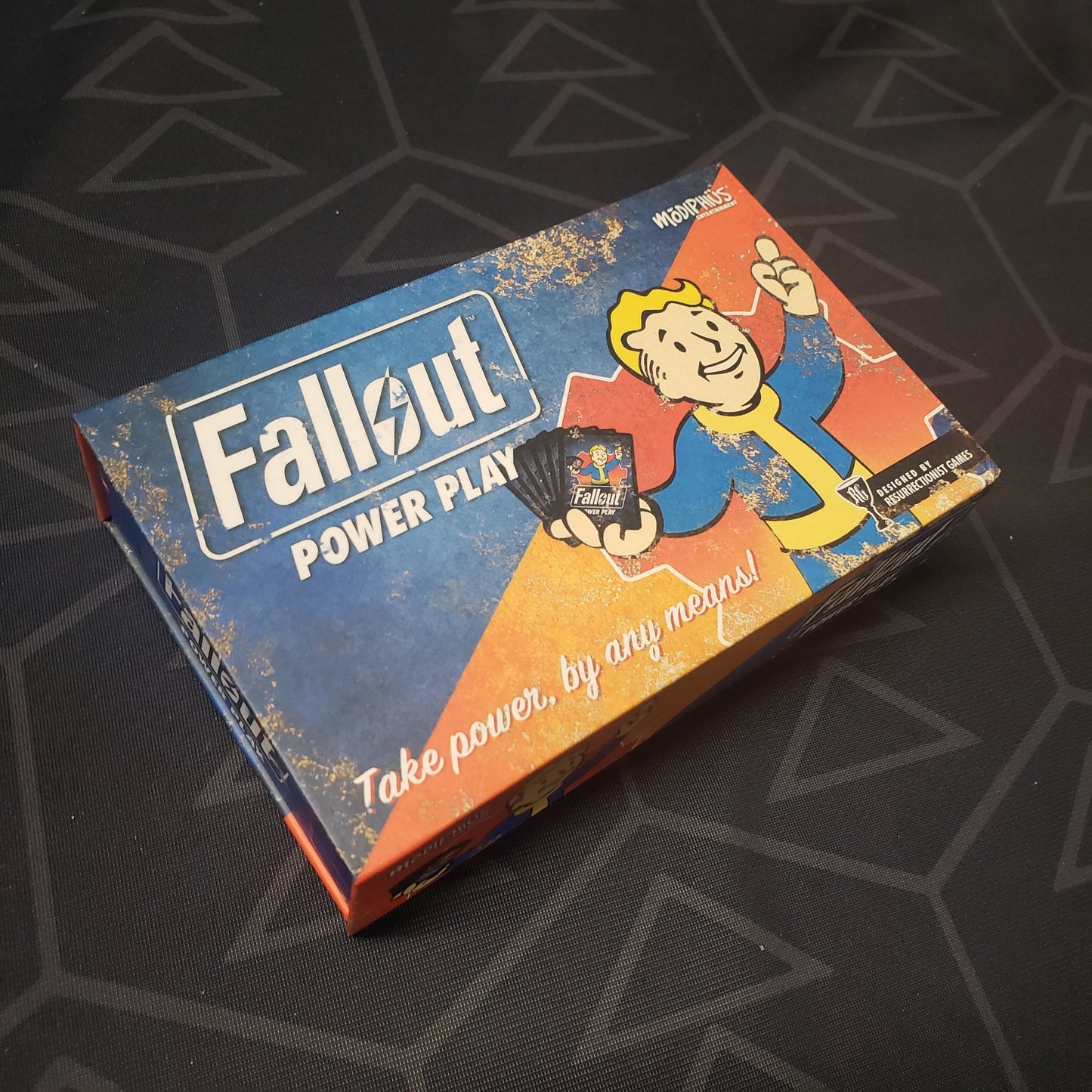 Image shows the front cover of the box for the Fallout: Power Play card game